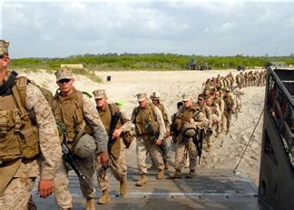 U.S. Marines embark a landing craft air cushion