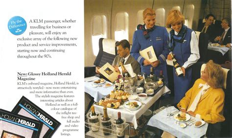 an advertisement for air new zealand with two women serving food and wine to the passengers