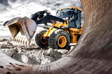 Premium Photo | Bulldozer or loader moves the earth at the construction ...