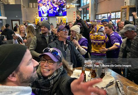 Minnesota Vikings fans react at the Off the Rails Public House bar in ...