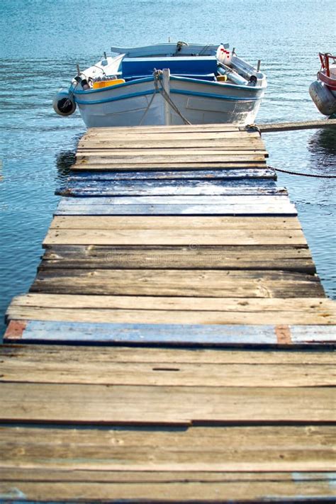 Wooden Pier and Fishing Boat Stock Photo - Image of aegean, classic ...