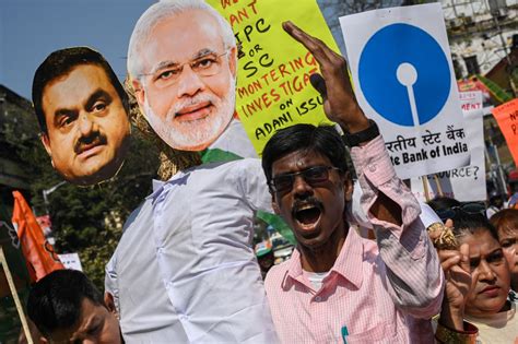 Protesters in India demand official investigation into Adani Group ...