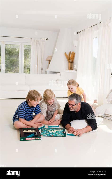 Family playing scrabble Stock Photo - Alamy