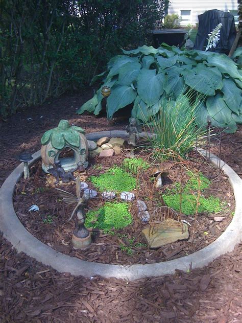 This fairy garden was made from a large fountain base that I purchased from a local garden ...