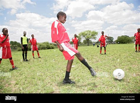 Black African boys playing football in Huntington village in South African Stock Photo - Alamy