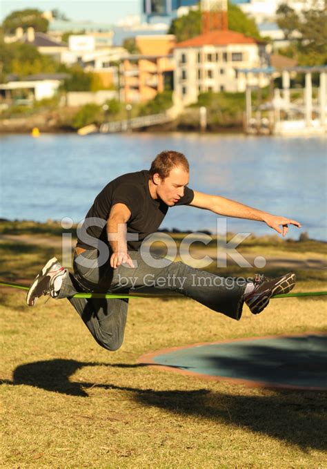 Slacklining Tricks Stock Photo | Royalty-Free | FreeImages