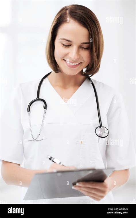 doctor with stethoscope writing prescription Stock Photo - Alamy