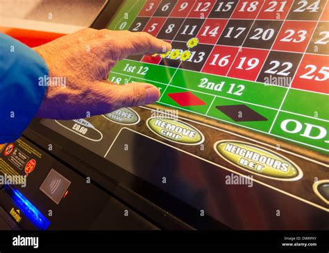 Fixed odds roulette machine (FOBT fixed odds betting terminal) in Bookmakers. UK Stock Photo - Alamy