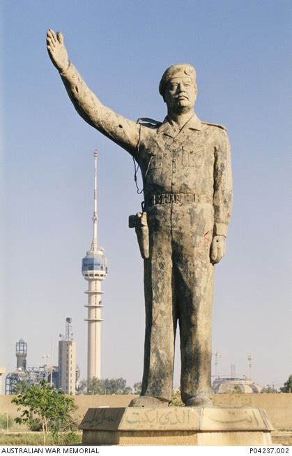 A statue of Saddam Hussein in central Baghdad is battered but still ...