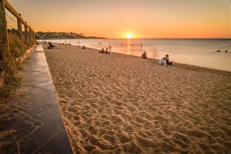 People watching the sunset at the beach in Frankston, Australia | Rockwood Real Estate