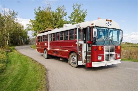 The Doghouse Red School Bus Conversion by Paved to Pines