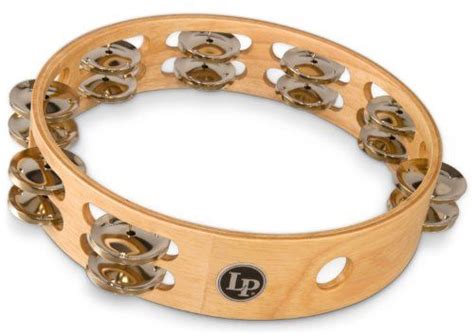 a wooden bracelet with metal studs on the side and an emblem in the middle