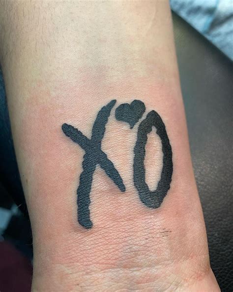 XO, Hugs and Kisses Tattoo on the Wrist by Shane