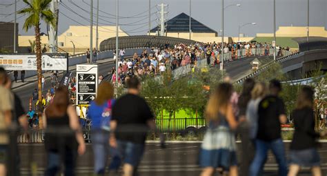 Fans make their way in the heat to the Garth Brooks concert at Allegiant Stadium on Friday, Jul ...