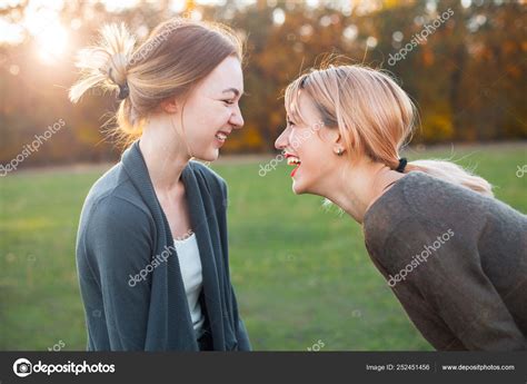 Two Best Friends Laughing Outdoors Stock Photo by ©Dima_Aslanian 252451456