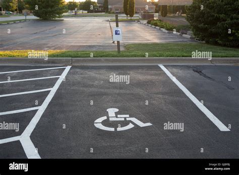 Handicap parking spaces and sign Stock Photo - Alamy