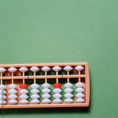 Japanese traditional abacus soroban on green background. Education and ...