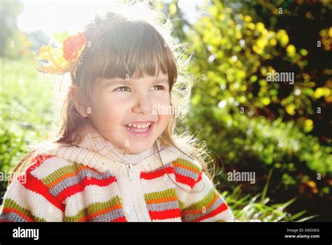 Laughing Little Girl Outdoors on Sunny Spring Day Stock Photo - Alamy