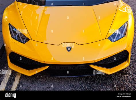 A yellow Lamborghini sports car in a uk street Stock Photo - Alamy