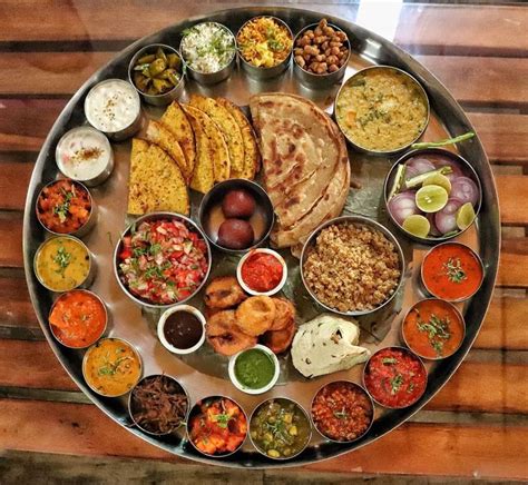 This enormous thali includes more than 25 dishes apart from the two drinks that are s… | Indian ...