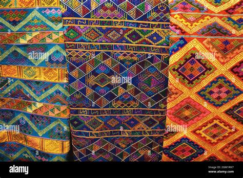 Colorful assortment of beautiful Bhutanese textiles with traditional ...