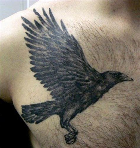 Natural looking colored flying crow tattoo on chest - Tattooimages.biz