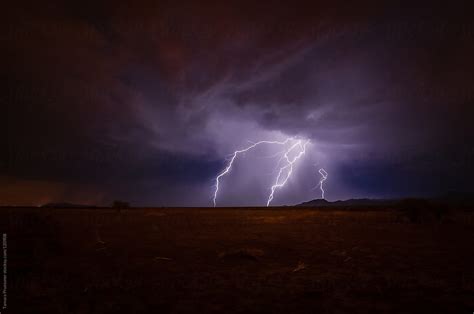 "Lightning Strikes At Night" by Stocksy Contributor "Tamara Pruessner" - Stocksy