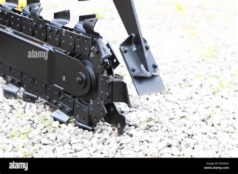 Trench digger industry detail machine for trenching Stock Photo: 60602589 - Alamy