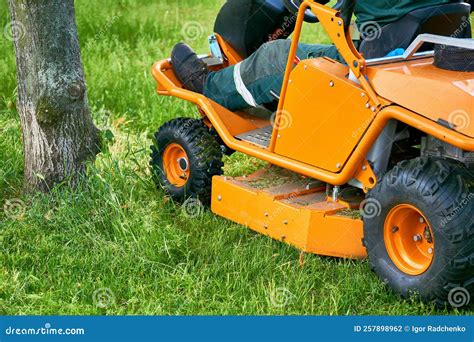 Professional Grass Cutting on Lawns with a Mini Tractor Lawn Mower. Stock Photo - Image of ...