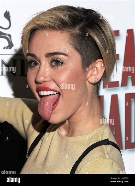 Miley cyrus sticks tongue out hi-res stock photography and images - Alamy