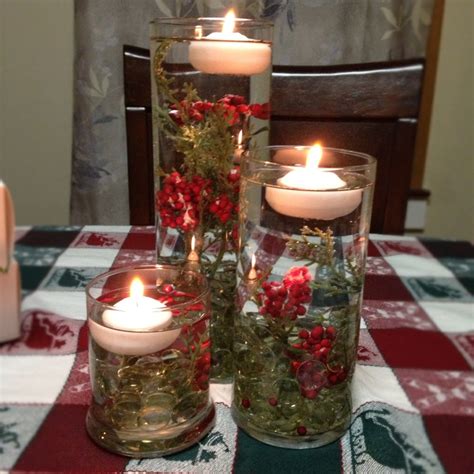 Holiday centerpiece with floating candles. I found the smaller two ...