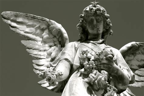 Statue of A Crying Angel IN Cemetery and Flower stock photos ...