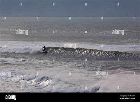 Surfing at Woolacombe Bay in North Devon. This stretch of the UK ...