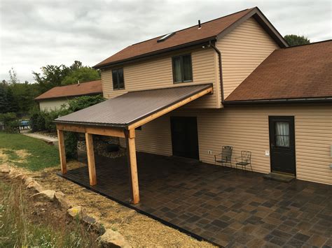 a house with a covered patio in front of it