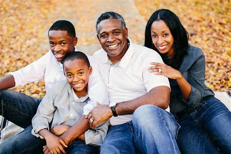 "A Beautiful African American Family Sitting Outside" by Stocksy ...