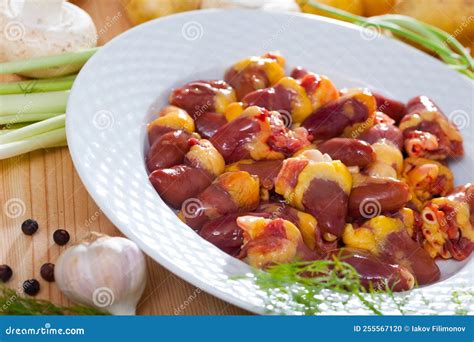 Raw Freshness Uncooked Chicken Hearts at Plate on Table Stock Photo ...