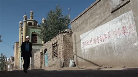 HOTAN - 10 SEPTEMBER 2010: Women Discuss Their Carpet Work In Hotan, China. Hotan Has ...