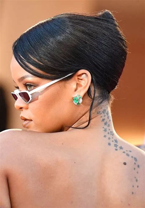 Rihanna's tattoos and the meaning behind them as she shows off chest ...