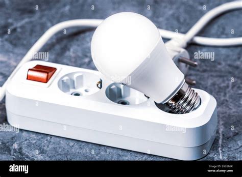 Electrical extension cord and light bulb Stock Photo - Alamy