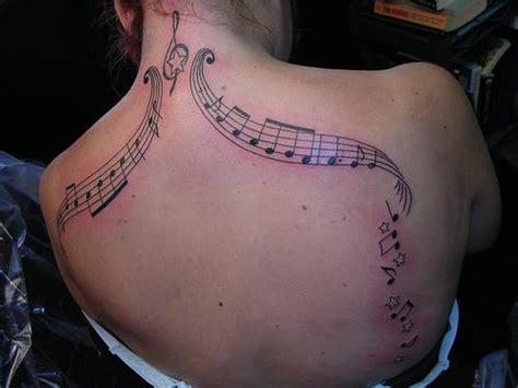 Music Notes Tattoo Designs On The Girl's Body