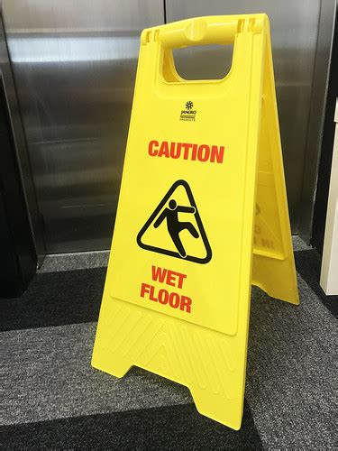 Stock photo image of a yellow 'caution wet floor' sign. | Flickr