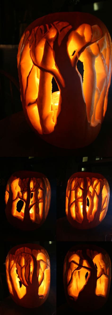 pumpkin carved to look like a tree with leaves and branches on it, all ...