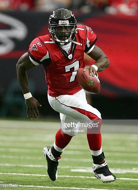 Michael Vick of the Atlanta Falcons runs upfield during their game against the New York Giants ...