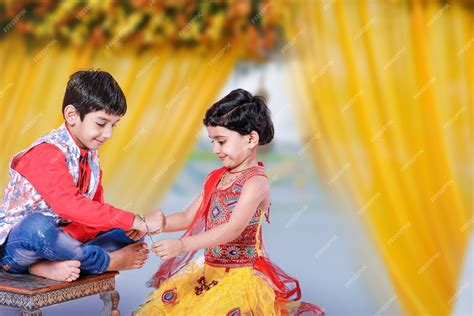 Premium Photo | Cute indian brother and sister celebrating raksha ...