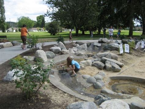 I like the water feature in this one. | Natural playground, Gardening for kids, Outdoor