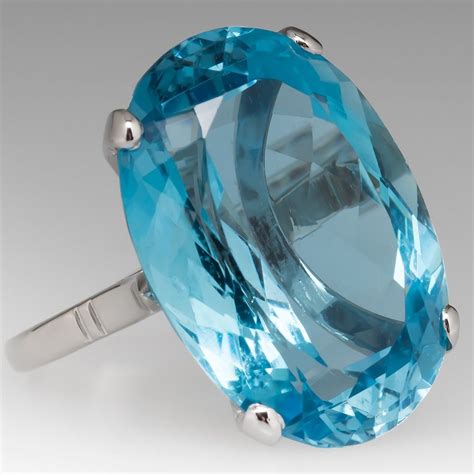 This jaw dropping vintage aquamarine cocktail ring features a 30 carat aqua set in an elegant ...