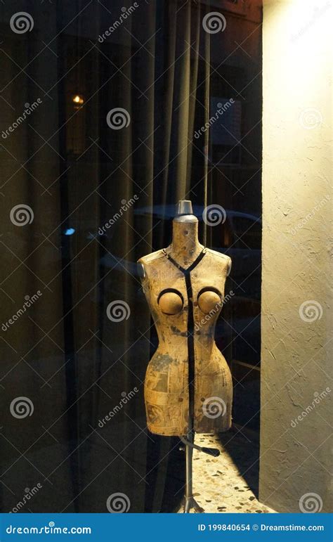 Showcase with Vintage Mannequin Behind Glass Stock Photo - Image of ...