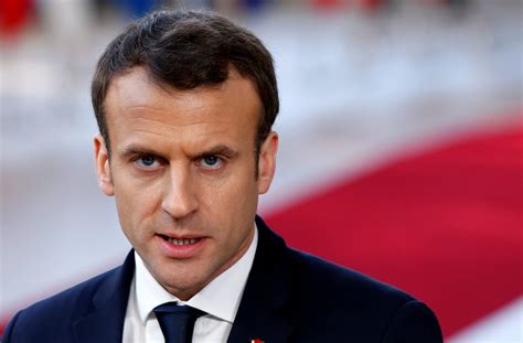 French President Emmanuel Macron briefs the media as he arrives at a European Union heads of ...