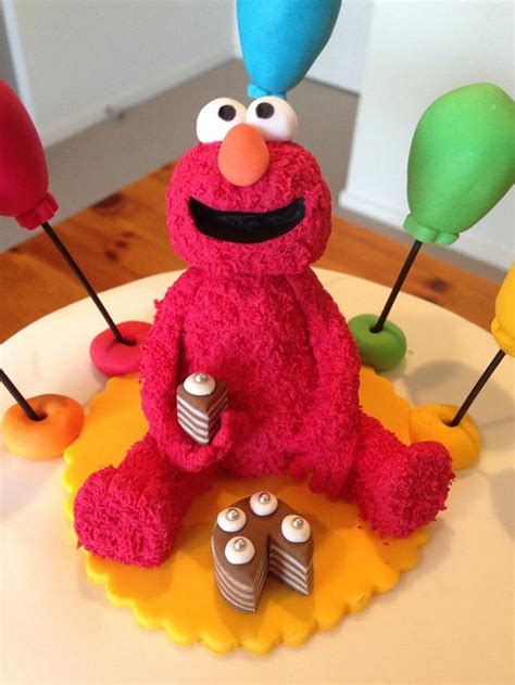 Colourful Elmo Cake - Decorated Cake by Stacey Howsan - CakesDecor