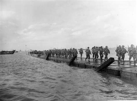 Troops coming ashore over pontoon causeway | Description: Tr… | Flickr